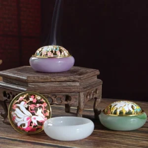 Nine-tailed fox liuli crystal incense burner set displayed overhead with assembled and disassembled pieces, showing lavender and jade green jade-style bases with gold-trimmed cloisonne lids and rising incense smoke