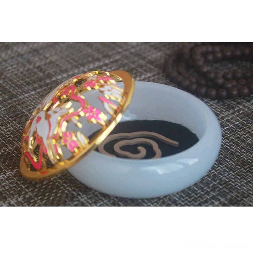 Disassembled nine-tailed fox incense burner set high side oblique view with pale blue-white jade-style base, gold-rimmed floral cloisonne lid, and exposed incense cone on woven prayer mat