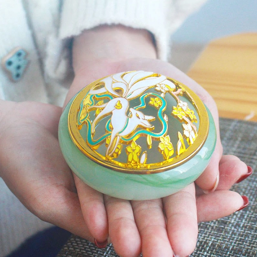 Nine-tailed fox incense burner with lit incense cone showing how to use the handcrafted Buddhist meditation burner for aromatherapy and spiritual practice