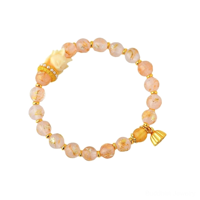 Nine-tailed fox lotus charm bracelet full circle view with pink glass beads, gold lotus charm and fox decorative bead on warm background