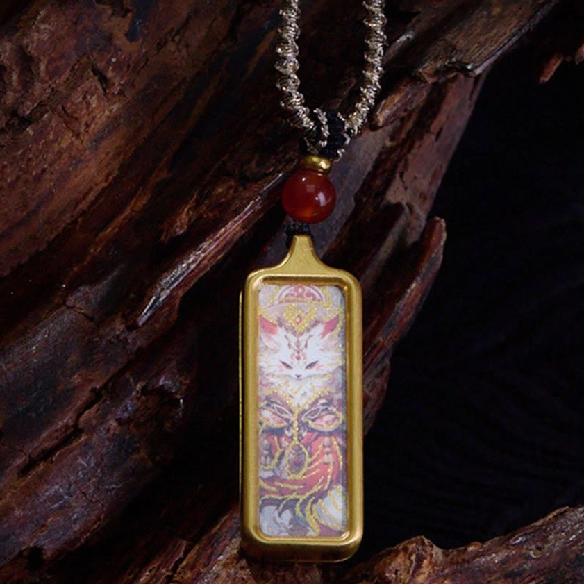 Nine-Tailed Fox Buddhist thangka pendant necklace with gold frame, red agate bead, twisted silver cord and nine-tailed fox mythical artwork