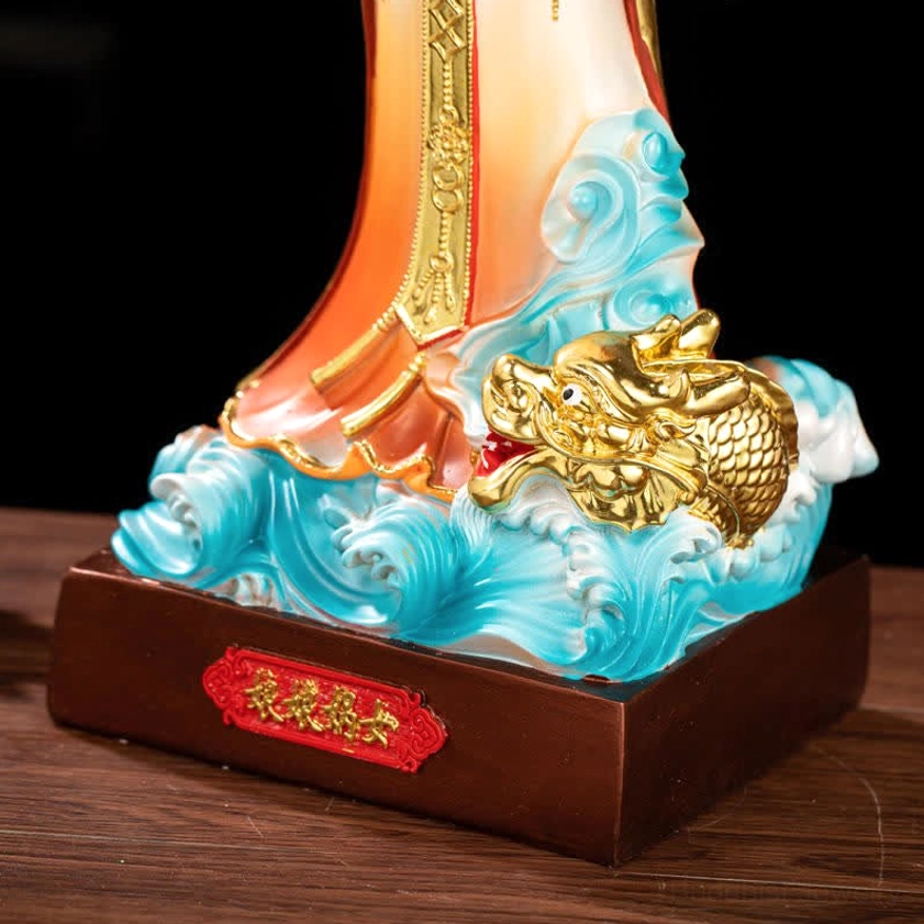 Nuwa Bodhisattva statue base detail showing blue wave texture golden dragon and wooden nameplate