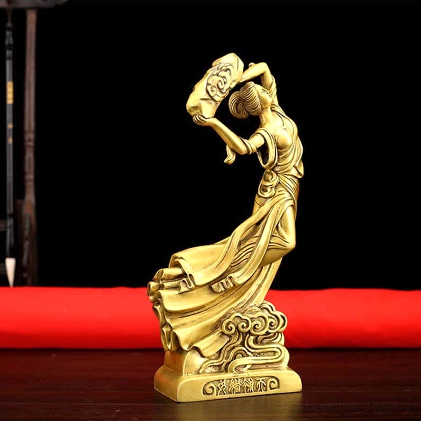 Close-up front view of handcrafted brass Nüwa statue showing visible facial features and polished golden brass texture