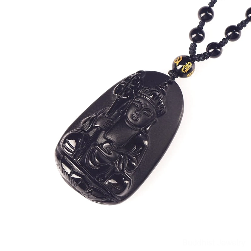 Black obsidian Buddha pendant necklace with decorative bead showing side profile and carving detail