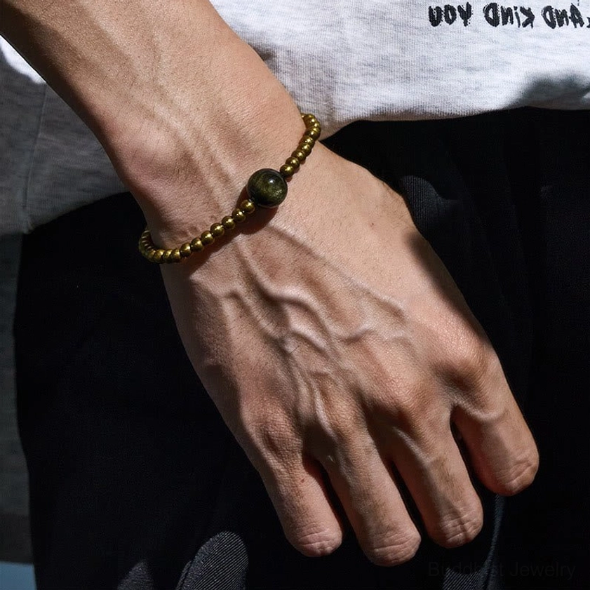Buddhist protective bracelet worn on hand showing daily wear styling and obsidian focal bead