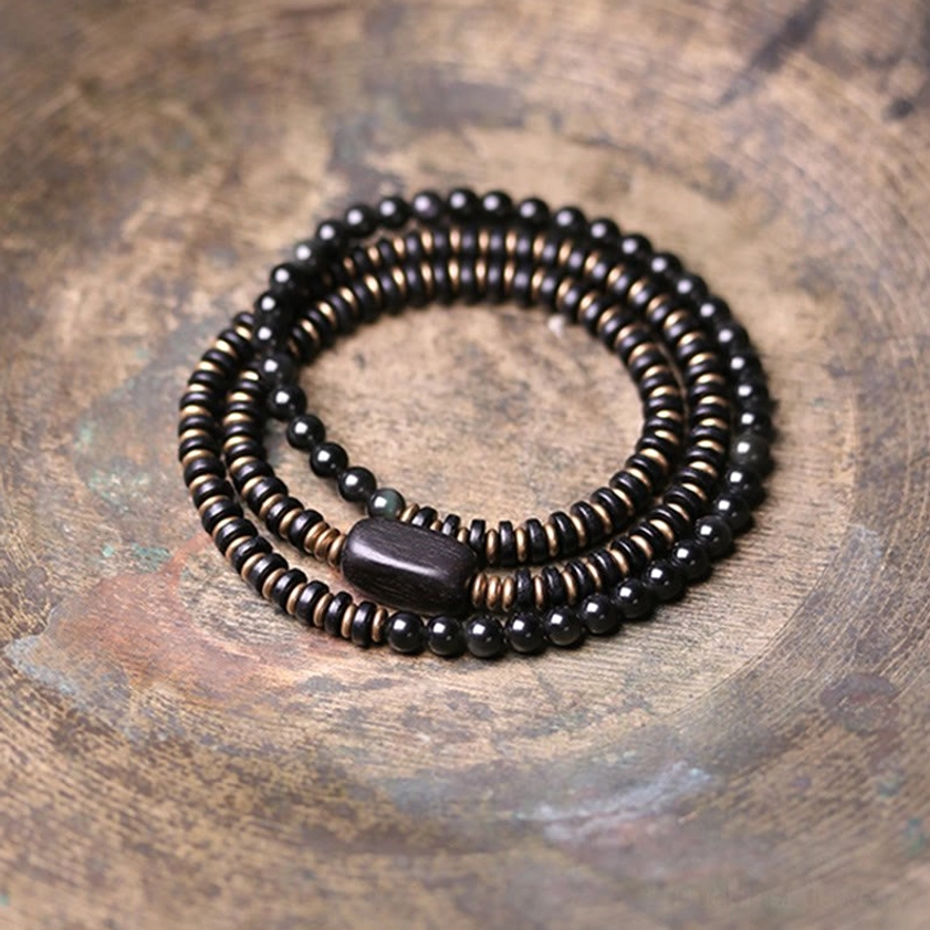 Handmade rainbow obsidian and ebony wood bracelet for anxiety relief and emotional balance, with premium elastic string