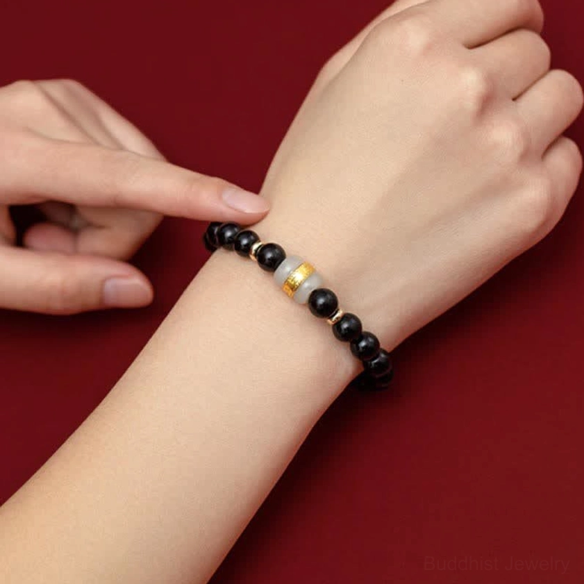 Black obsidian and jade mantra bracelet for prosperity and abundance, perfect for couples seeking shared spiritual energy