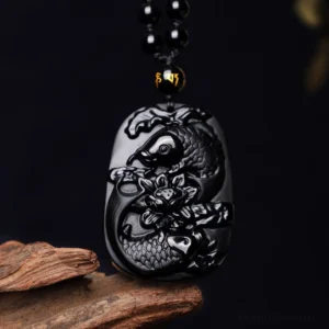 Black Obsidian Koi Fish Lotus Pendant Necklace - overhead flat lay showing carved relief details and beaded chain