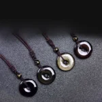 Black obsidian donut pendant necklaces - multi-color variants collection set flat lay