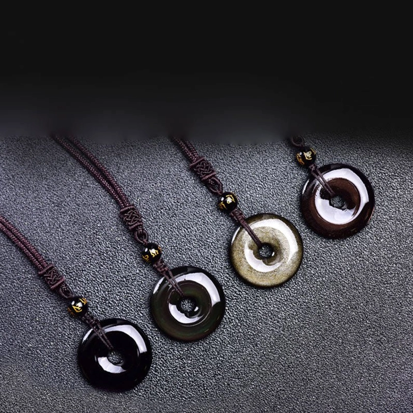 Black obsidian donut pendant necklaces - multi-color variants collection set flat lay