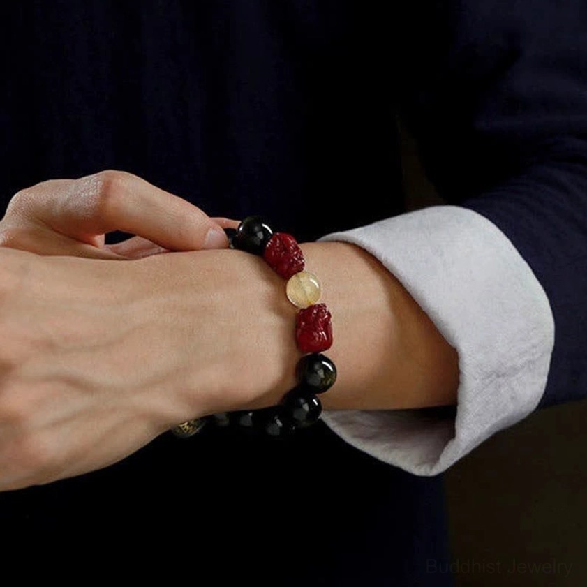 Pixiu cinnabar obsidian bracelet on wrist rear view displaying protective Buddhist jewelry