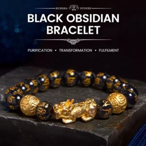Black Obsidian Pixiu Wealth Bracelet with gold charm and engraved beads - top flat lay view