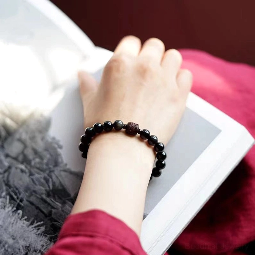 Obsidian bracelet with red sandalwood wood beads cinnabar accents traditional Buddhist craft materials