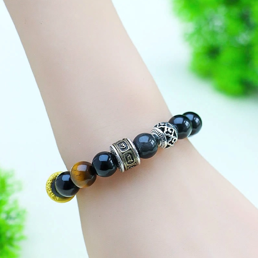 Worn Buddhist protection bracelet on human wrist showing comfort and everyday wear styling