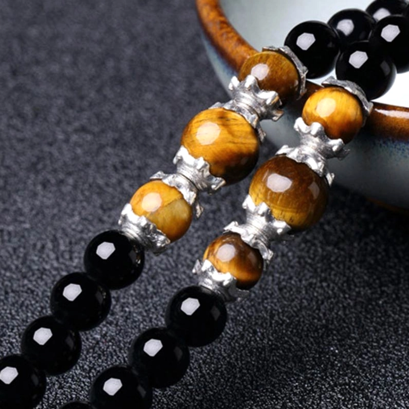 Black obsidian tiger eye 108 bead Buddhist prayer mala bracelet showing bead texture and quality craftsmanship