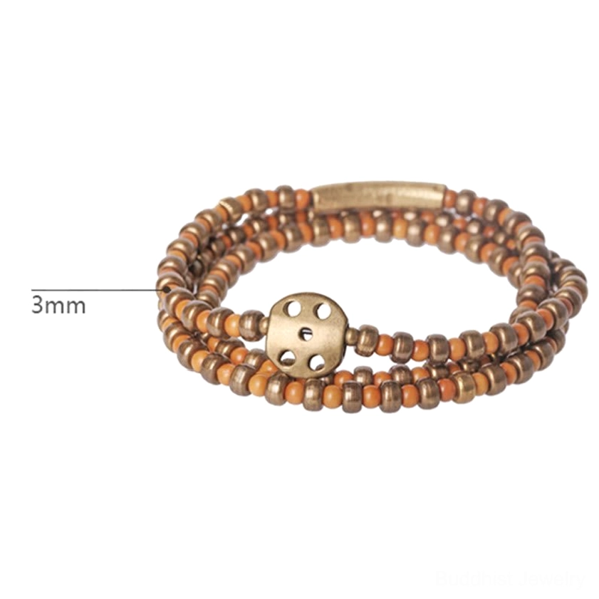 Olive pit copper bracelet with 3mm bead size label and hollow bronze circular clasp on white background