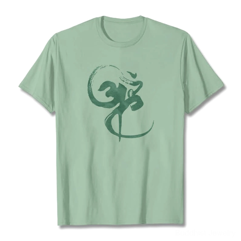Pale green Om sacred mantra graphic cotton t-shirt front flat lay spiritual design