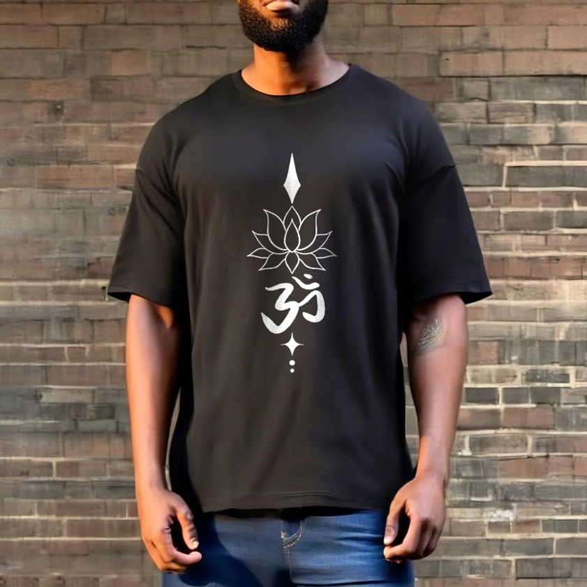 Black spiritual graphic tee with Om lotus design worn outdoors brick wall background