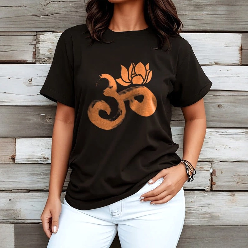 Female model wearing OM Lotus Flower Buddhist black cotton t-shirt white denim pants spiritual fashion