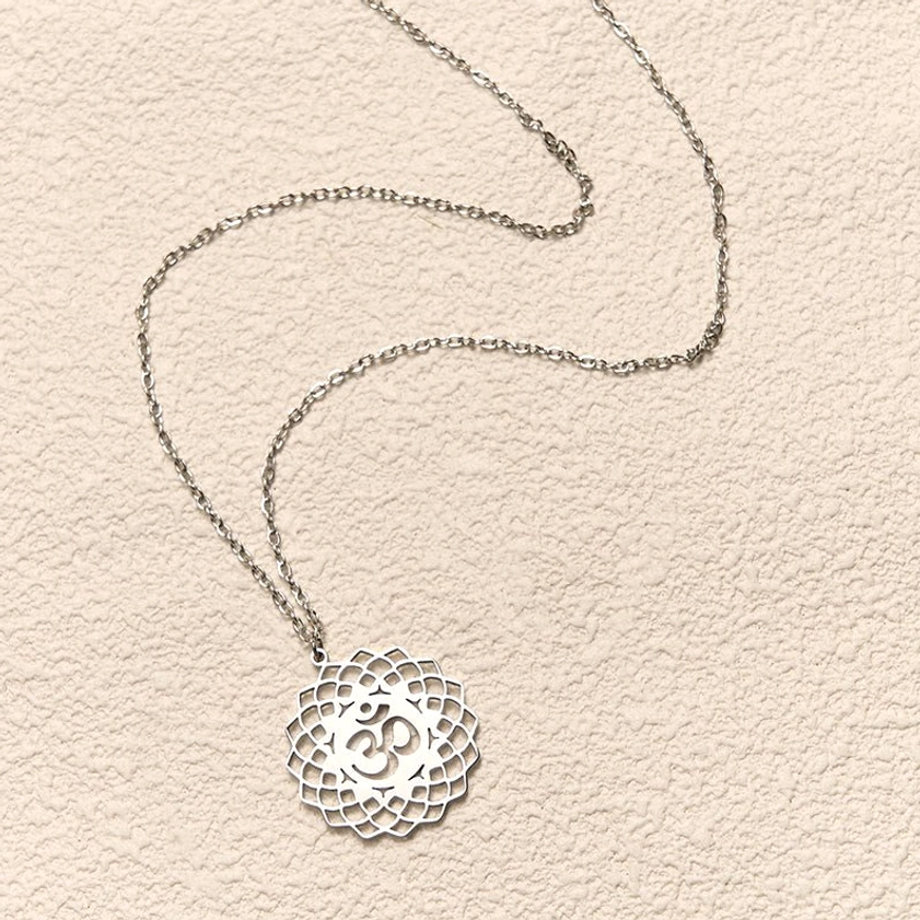 Om lotus pendant necklace detail shot hollow carved Buddhist symbol