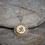Gold tone Om lotus hollow stainless steel Buddhist necklace pendant front view
