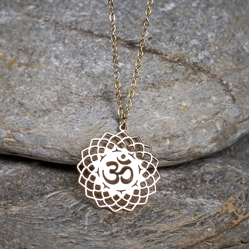 Silver Om lotus hollow carved Buddhist pendant necklace top down view