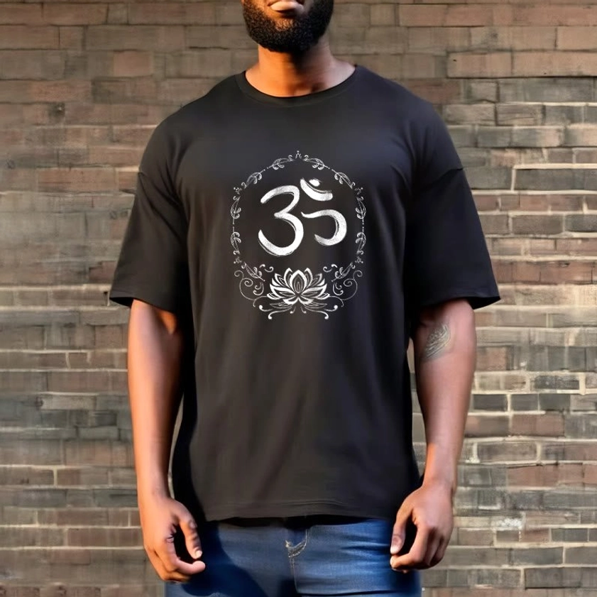 Male model wearing OM lotus graphic t-shirt in black with crew neck, half-body front view