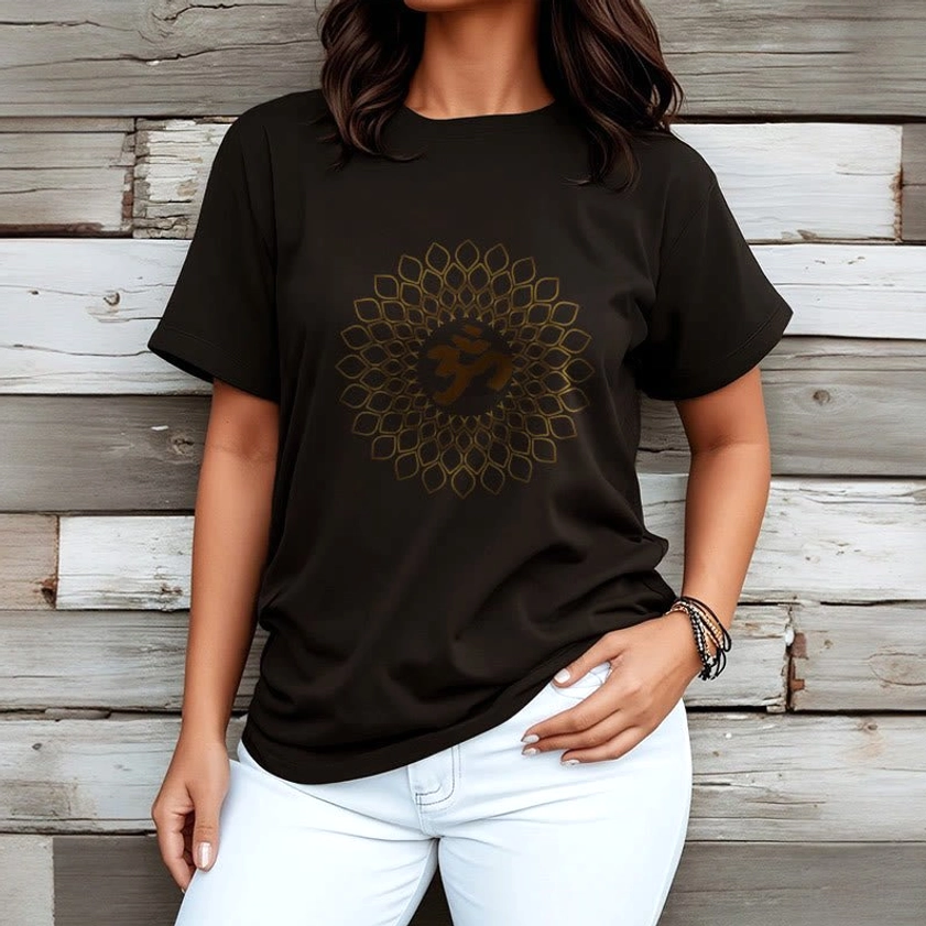 Woman wearing om mandala diamond black cotton t-shirt with white pants wooden wall background