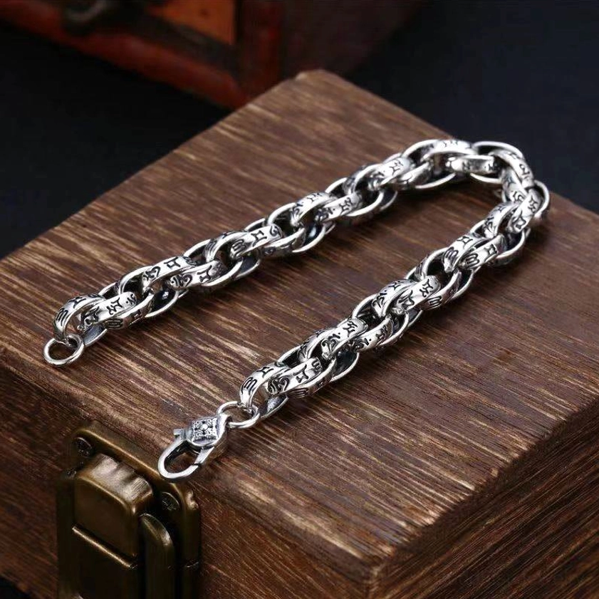 Flat-lay side view of Om Mani Padme Hum spiritual bracelet displaying both end clasps and complete engraved text