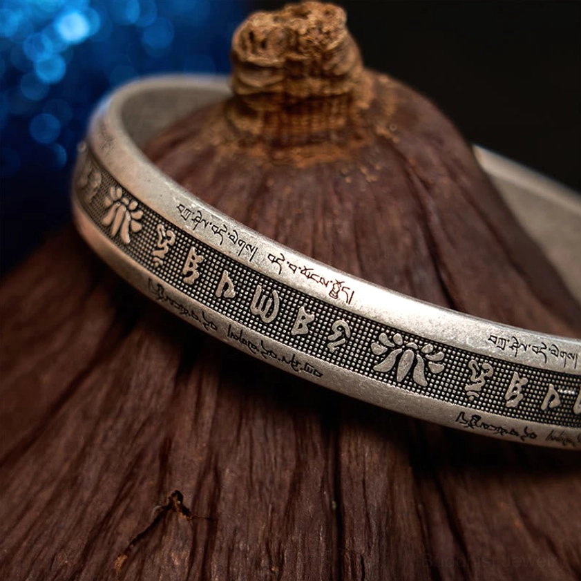 Buddhist meditation bracelet with Om Mani Padme Hum sacred mantra, versatile unisex cuff design
