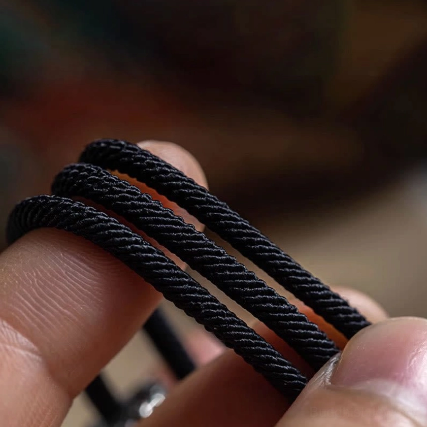 Premium braided black cord texture of Om Mani Padme Hum Buddhist mantra bracelet