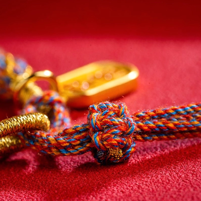 Handcrafted Om Mani Padme Hum bracelet knot and metal fittings showing adjustable braided design