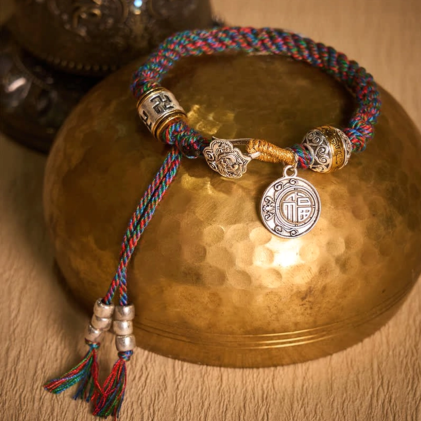 Buddhist Symbols Bracelet with Fu Character Pendant on Brass Singing Bowl Aerial View