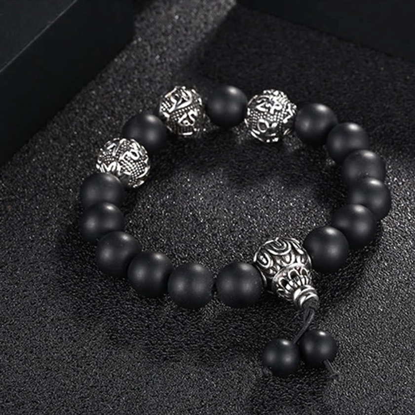 Buddhist prayer bracelet flat lay showing complete design with three gemstone color options and mantra engravings