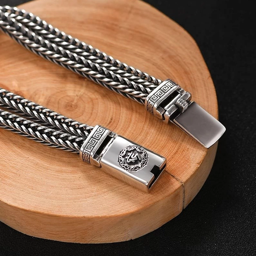Two Om Mani Padme Hum copper bracelets displayed together showing buckle engraving with Six True Words and braided pattern