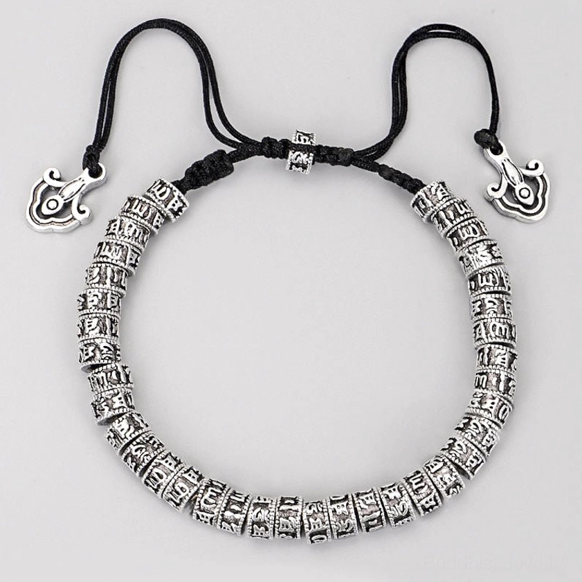 Buddhist mantra prayer bracelet featuring cloud-shaped metal pendants and adjustable black rope, front flat lay