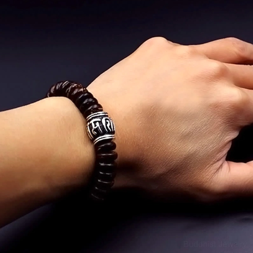 Om Mani Padme Hum Buddhist bracelet gift packaging showing handmade natural coconut spiritual jewelry