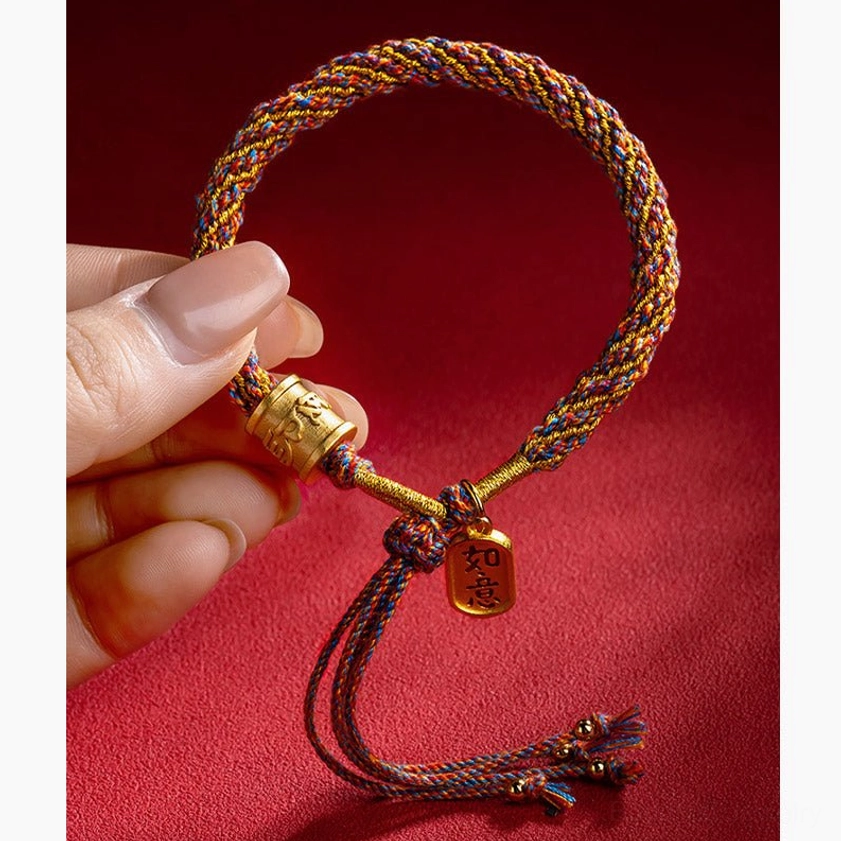 Om Mani Padme Hum spiritual bracelet held in hand with adjustable Ruyi charm tag