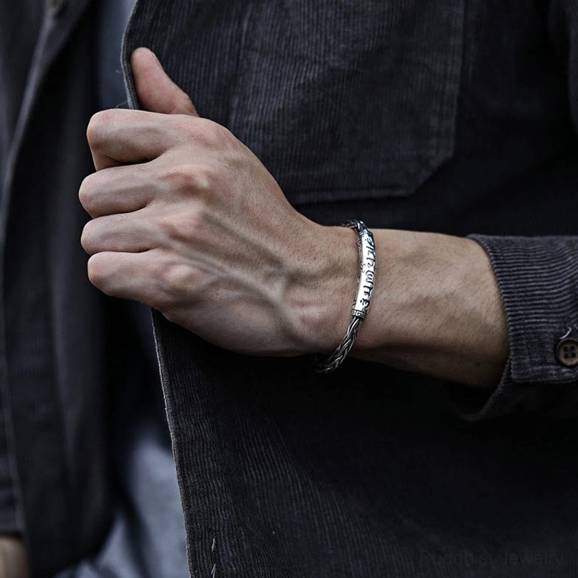 Om Mani Padme Hum copper bangle worn on male wrist showing slim elegant fit
