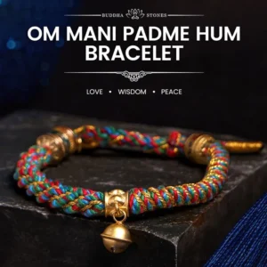 Om Mani Padme Hum multicolored Buddhist string bracelet with gold bell charm on dark display platform