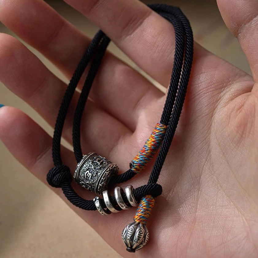 Buddhist mantra Om Mani Padme Hum double wrap bracelet in natural light showing authentic patina