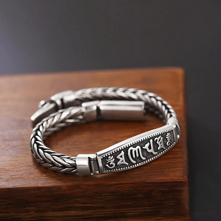 Flat side profile of Om Mani Padme Hum bracelet with twisted braided chain and engraved spiritual mantra plaque detail
