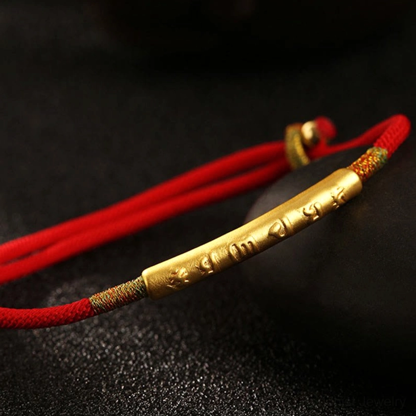 Single Om Mani Padme Hum mantra bracelet with gold engraved straight tube charm on matte black background