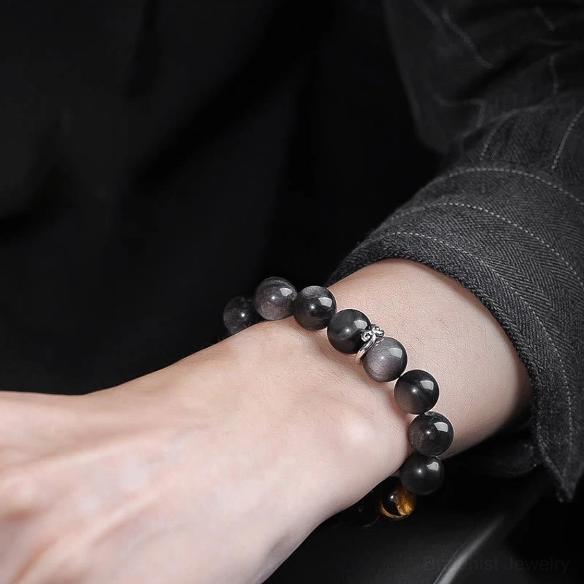 Silver Sheen Obsidian and Tiger's Eye Buddhist bracelet size comparison showing 10mm and 12mm bead options with engraved charm details