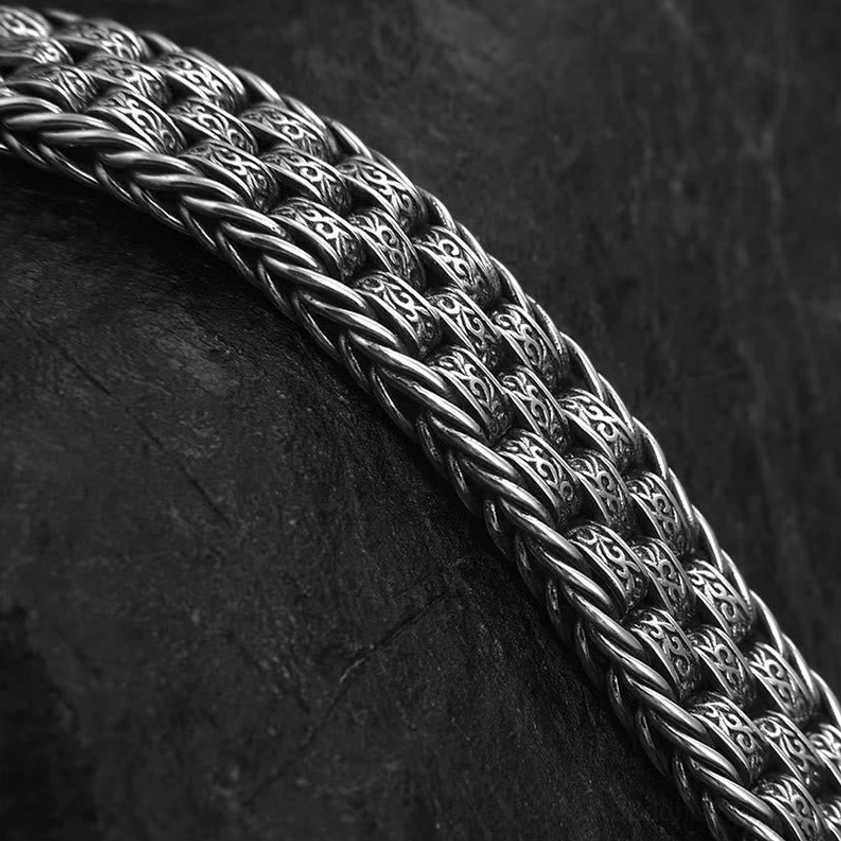 Buddhist mantra bracelet detailed view of handcrafted Tang Dynasty floral design and copper braided texture