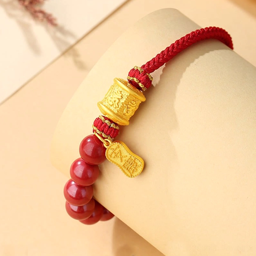 Cinnabar and sterling silver bracelet worn on wrist - close-up lifestyle shot