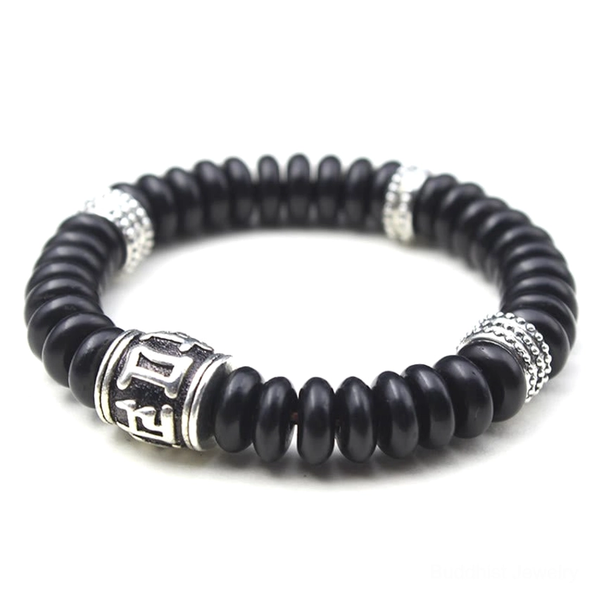 Om Mani Padme Hum coconut shell bracelet styled on wrist showing comfortable elastic fit for daily wear