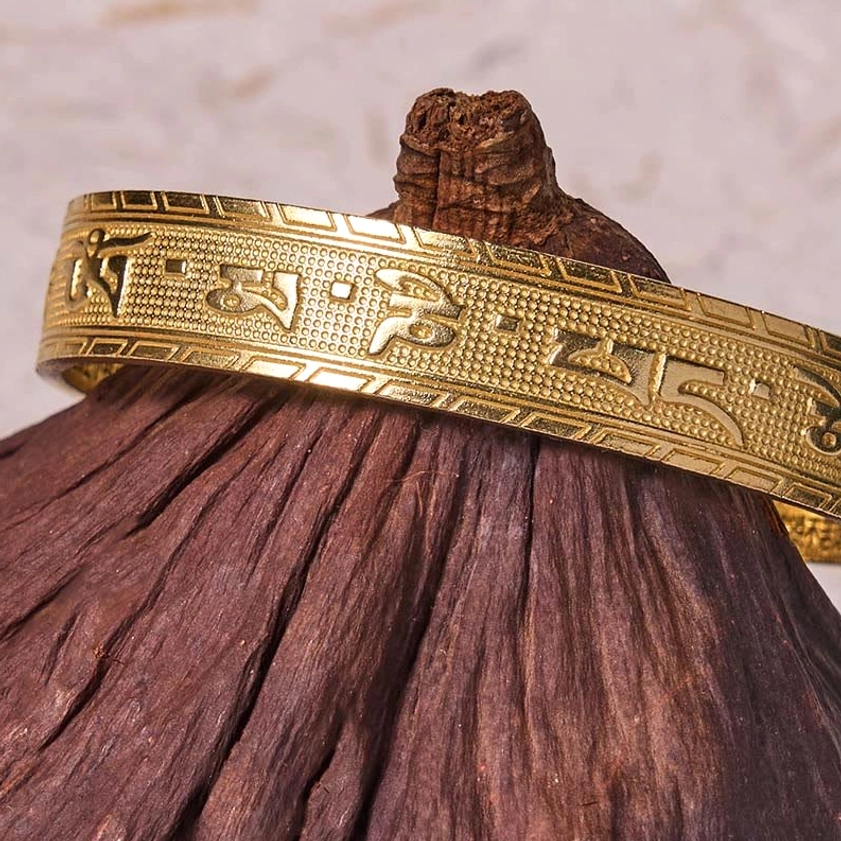 Sacred Om Mani Padme Hum brass bangle adjustable open cuff bracelet showing complete mantra engraving and craftsmanship detail