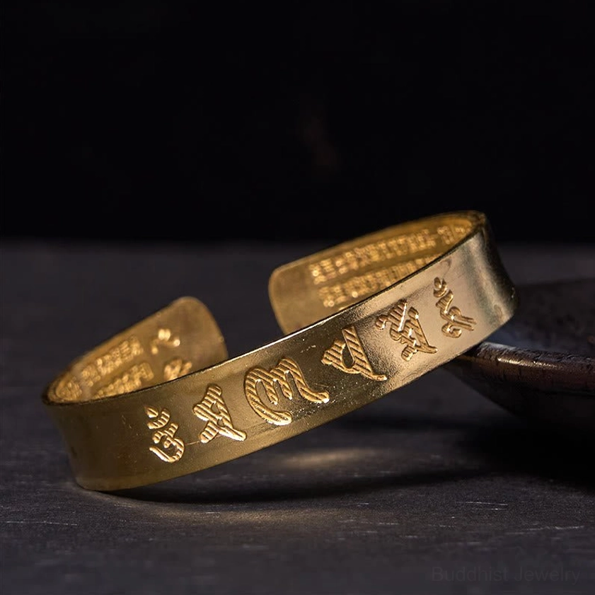 Om Mani Padme Hum polished brass cuff bracelet bright finish engraved mantras top-down view