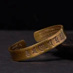 Om Mani Padme Hum brass open cuff bracelet with engraved Heart Sutra, antique bronze finish side view